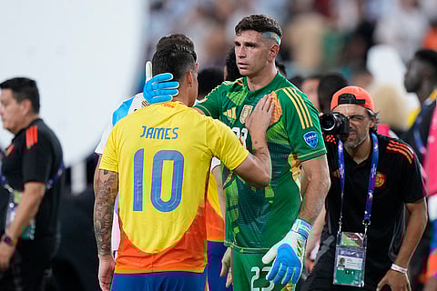 Emiliano Martinez consoles James Rodriguez